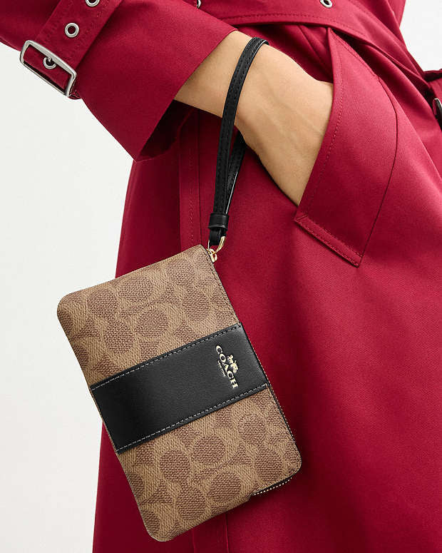 Coach Corner Zip Wristlet In Signature Canvas With Stripe