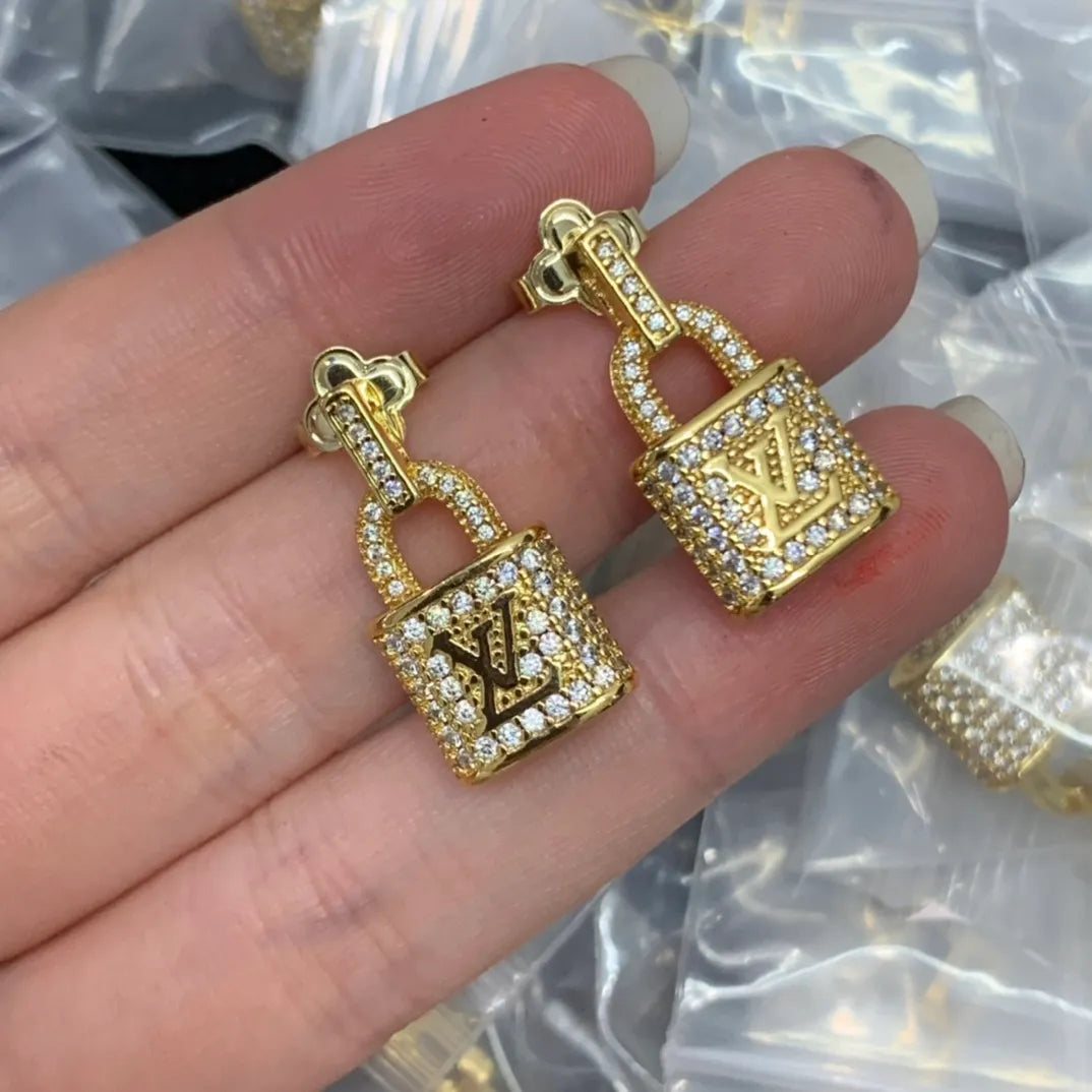 LV Gold lock earrings