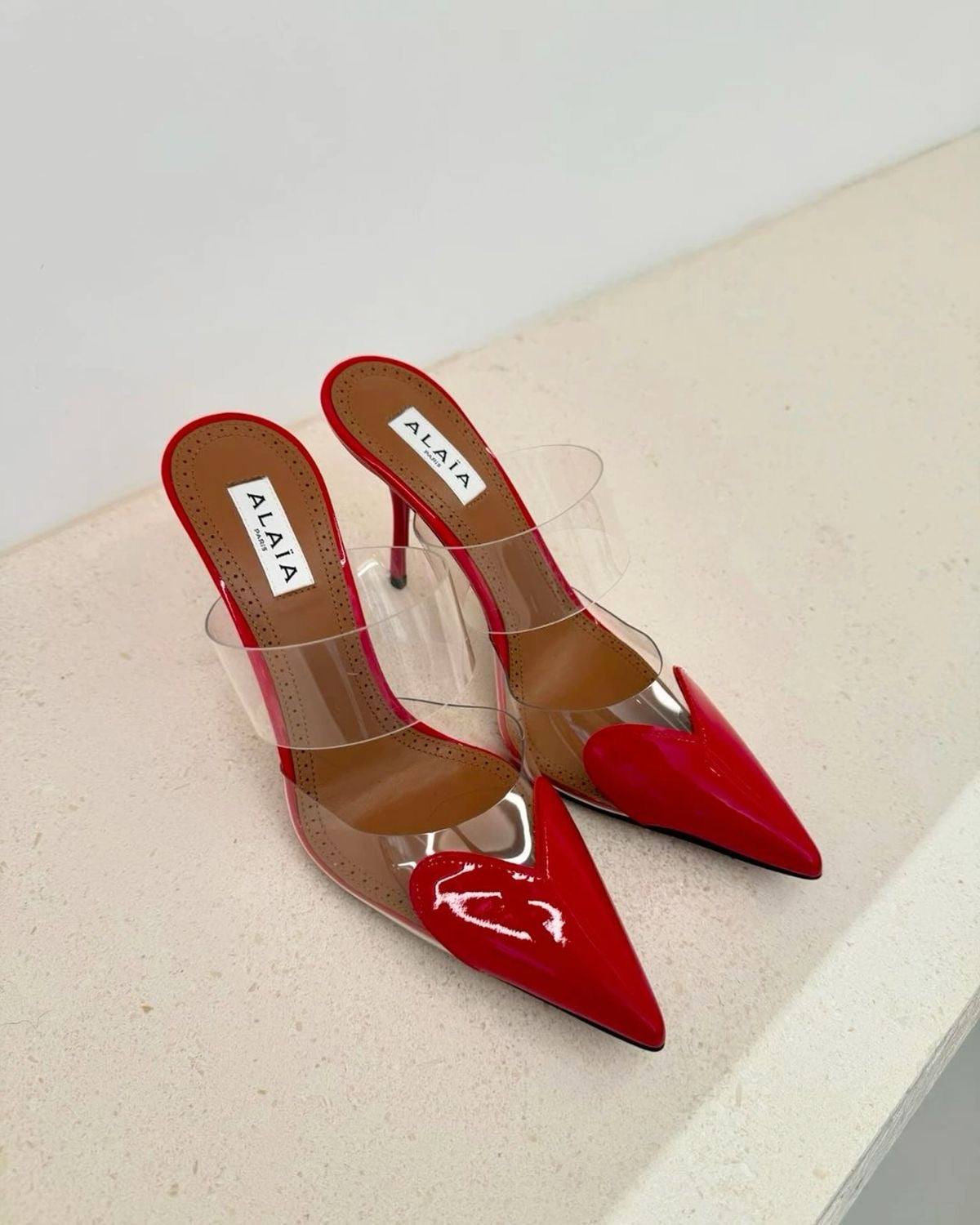 ALAiA  LE CŒUR MULES IN PATENT LEATHER ❤️