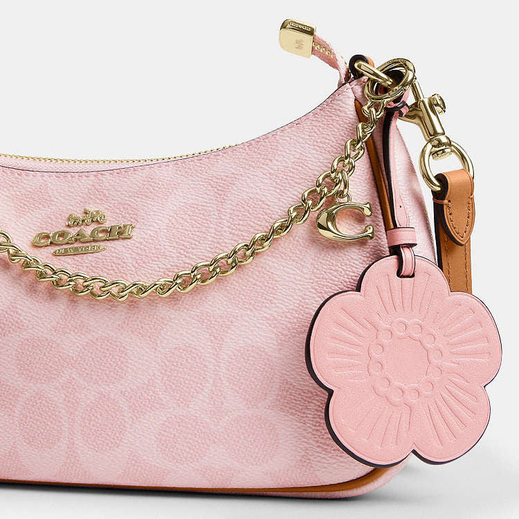 Teri Shoulder Bag
In Signature Canvas With Charm