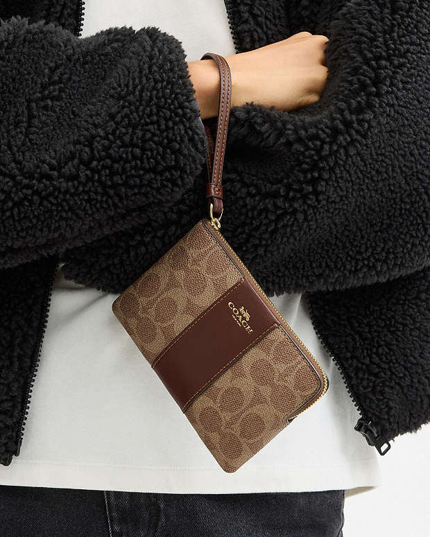 Coach Corner Zip Wristlet In Signature Canvas With Stripe