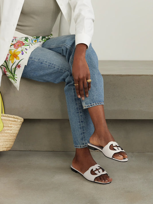 GUCCI
Cutout leather slides White