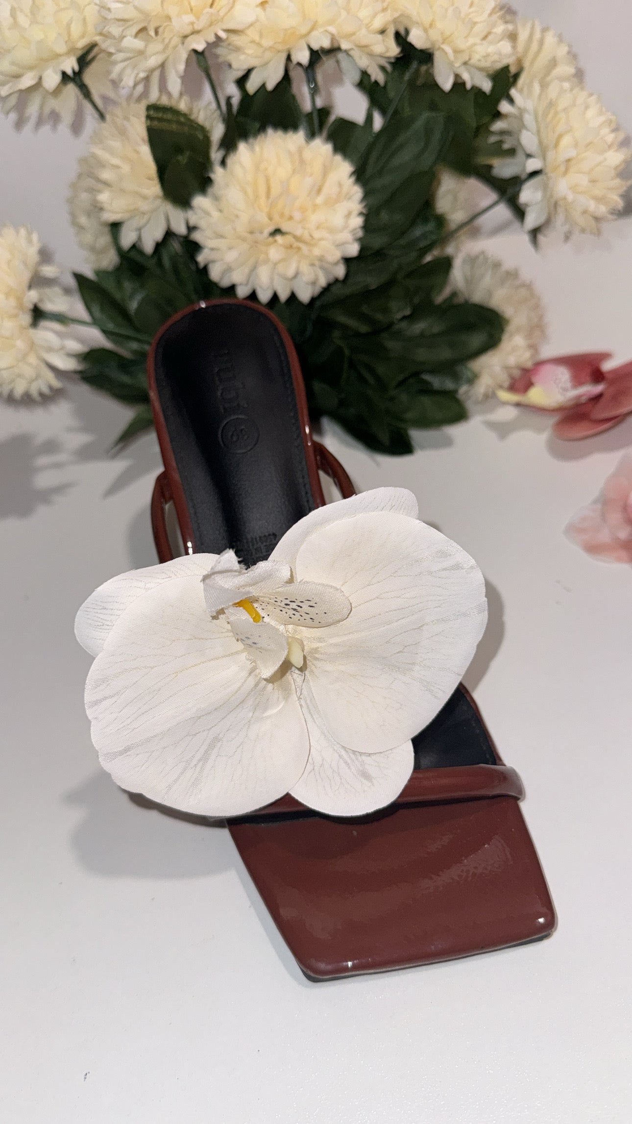 White orchid shoe attachment