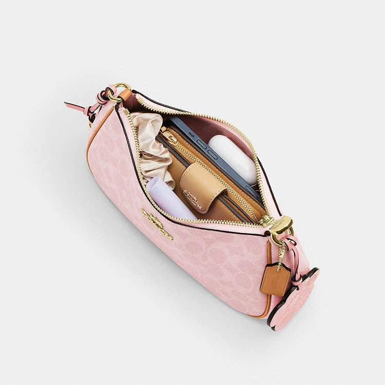 Teri Shoulder Bag
In Signature Canvas With Charm