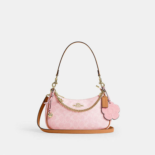 Teri Shoulder Bag
In Signature Canvas With Charm