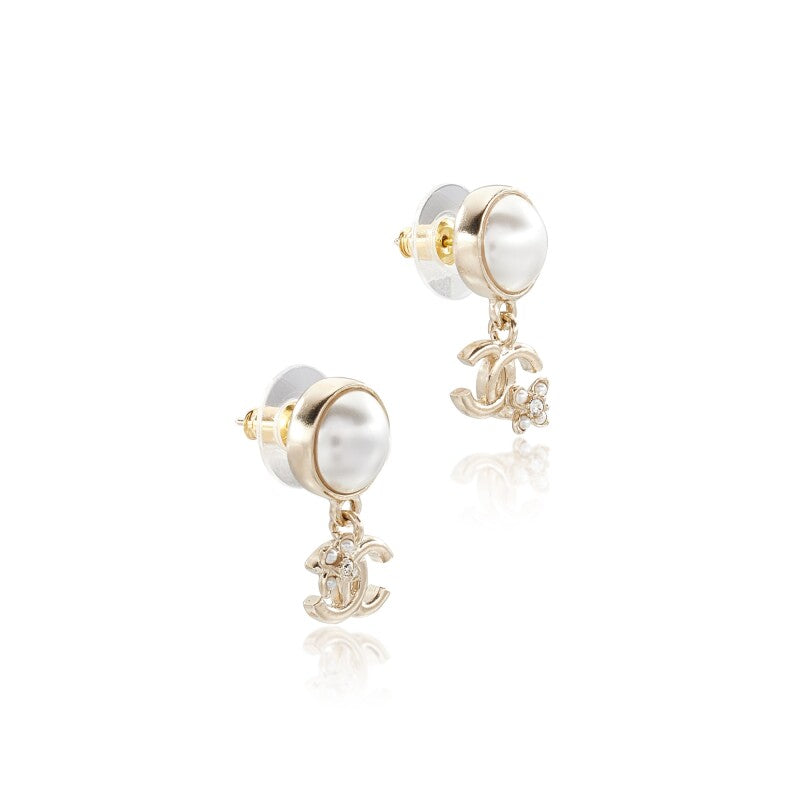 Chanel
Pale Gold Metal and Imitation Pearl CC Earrings
