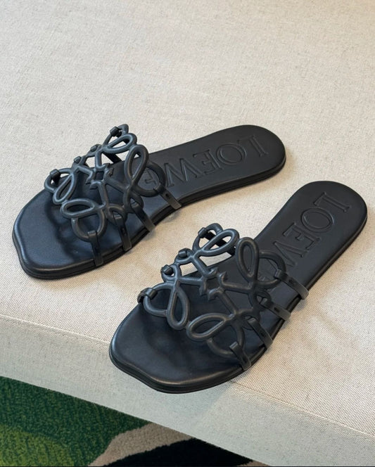 LOEWE
Black Leather Petal Anagram Slides