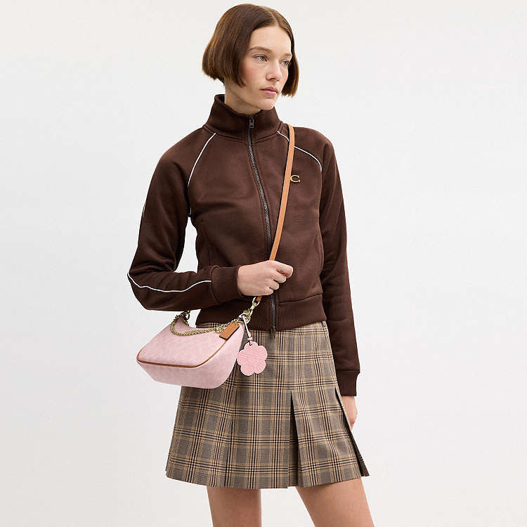 Teri Shoulder Bag
In Signature Canvas With Charm