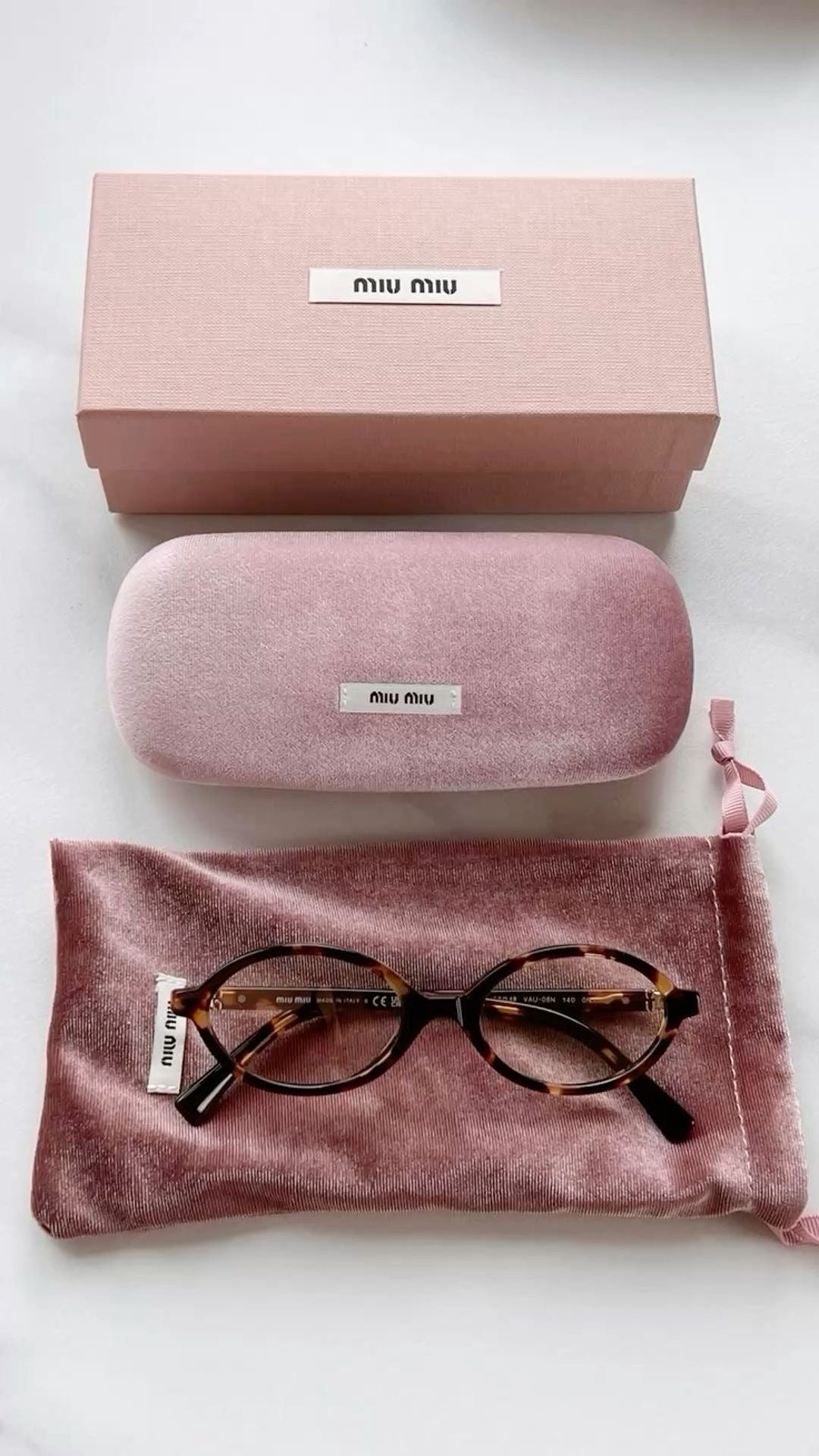 Miu Miu oval sunglasses Brown