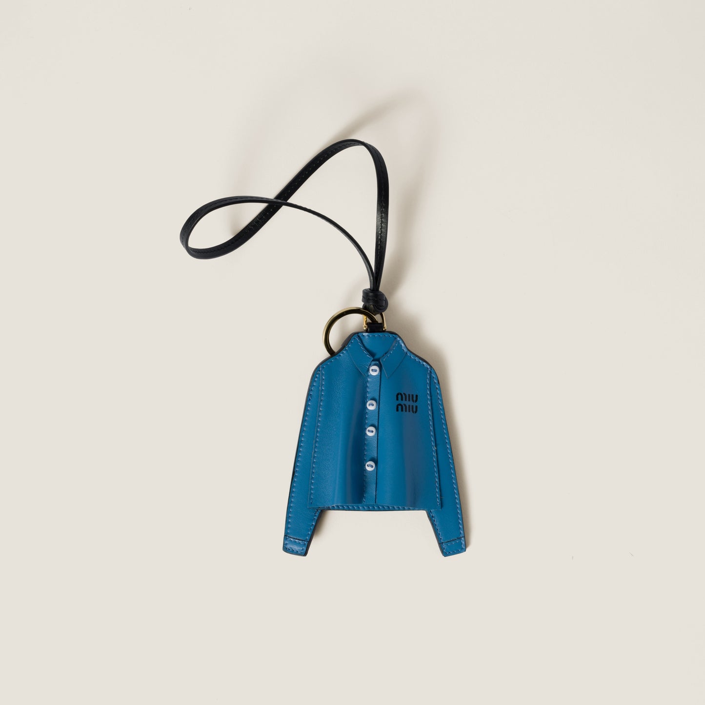 MIU MIU

Shirt leather keychain trick